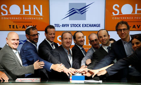 Speakers, including UK hedge fund Lansdowne Partners Chairman Stuart Roden (2nd R), take part in the opening bell ceremony of the Tel Aviv Stock Exchange before the Sohn Conference in Israel October 26, 2016. REUTERS/Baz Ratner