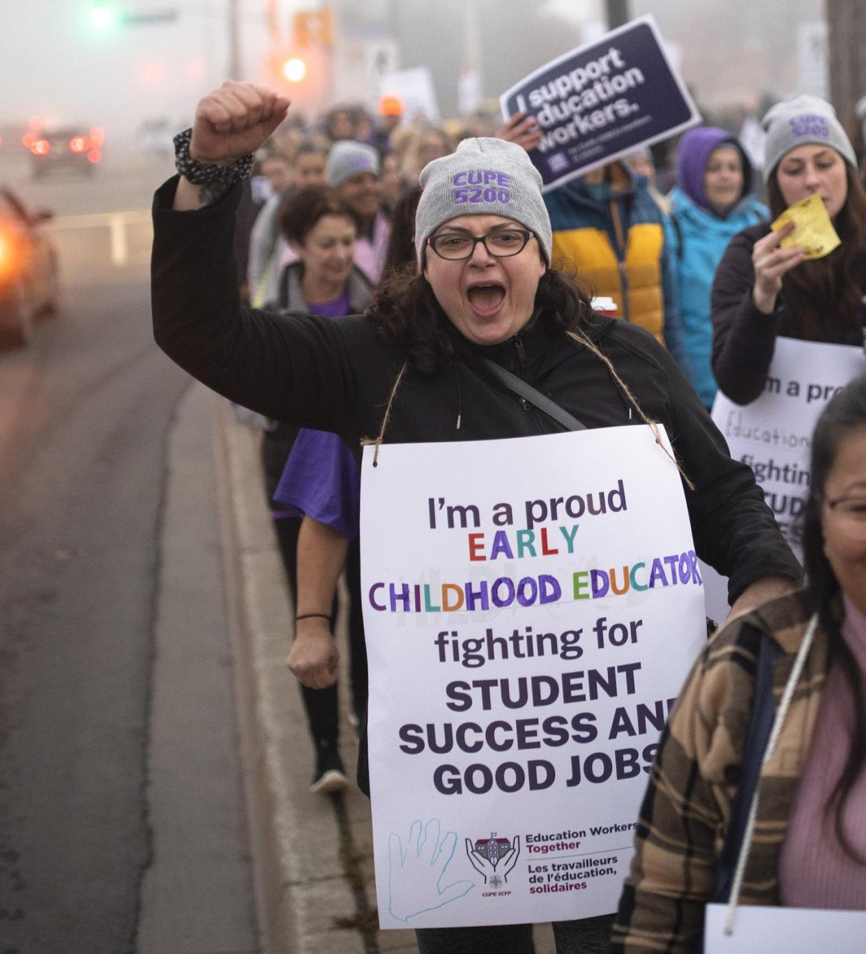 CUPE members and supporters join a demonstration outside the office of Parm Gill, Member of Provincial Parliament for the riding of Milton, Ont., on Nov. 4, 2022. THE CANADIAN PRESS/Nick Iwanyshyn