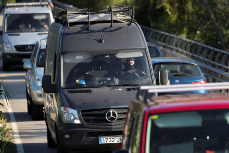 Catalan Mossos D'Esquadra officers leave the scene where Younes Abouyaaqoub, the man suspected of driving the van that killed 13 people in Barcelona last week, was killed by police in Subirats, Spain, August 21, 2017. REUTERS/Albert Gea