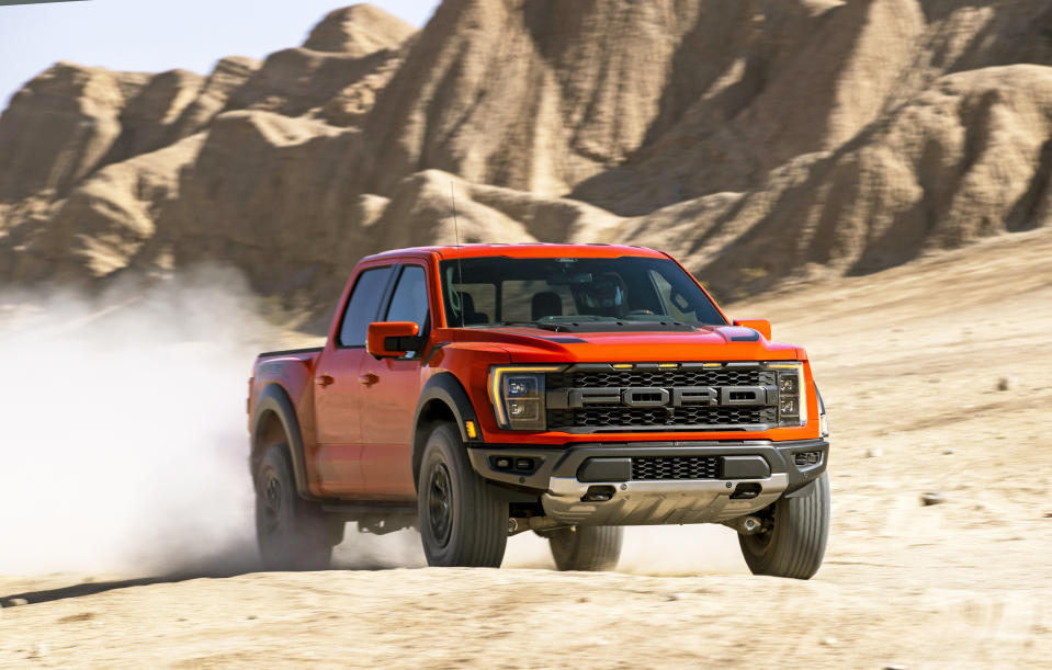 This photo provided by Ford Motor Co. shows the 2021 Ford F-150 Raptor, a full-size pickup truck that has been heavily modified from the factory for high-speed desert drives. We’re in a golden age of off-road pickup trucks that you can buy straight from the factory, and the Ford F-150 Raptor and Ram 1500 TRX are the most high-profile examples. (Courtesy of Ford Motor Co. via AP)