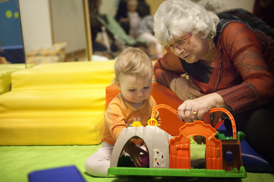 Intergenerational projects set up in a kindergarten and Nursery School, Switzerland, volunteer retirees take part in the days organization by participating in the activities. (Photo by: BSIP/Universal Images Group via Getty Images)