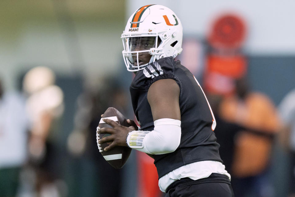 FILE - Miami quarterback Cam Ward (1) prepares to throw during NCAA college football practice in Coral Gables, Fla., Monday, March 4, 2024. Ward played his first spring game with the Hurricanes on Saturday, April 13, 2024. The Washington State transfer hasn't wasted any time becoming the full-fledged leader of a Miami team hoping to contend for a college football playoff spot in 2024. (Matias J. Ocner/Miami Herald via AP, File)