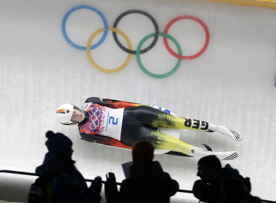 Natalie Geisenberger of Germany speeds down the track in her second run during the women's singles luge competition at the 2014 Winter Olympics, Monday, Feb. 10, 2014, in Krasnaya Polyana, Russia. (AP Photo/Natacha Pisarenko)