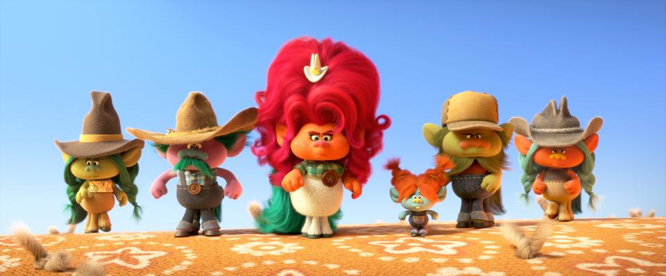 Delta Dawn (center, voiced by Kelly Clarkson) heads up a crowd of country-loving cowpokes in "Trolls World Tour."