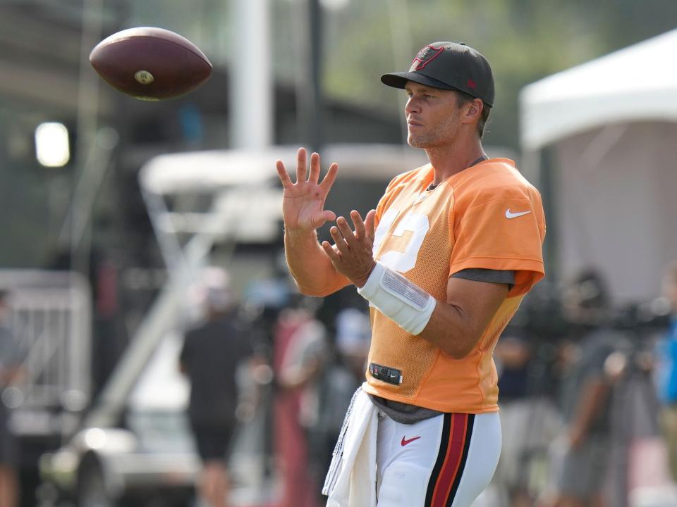 Tom Brady stands at practice during Buccaneers training camp.