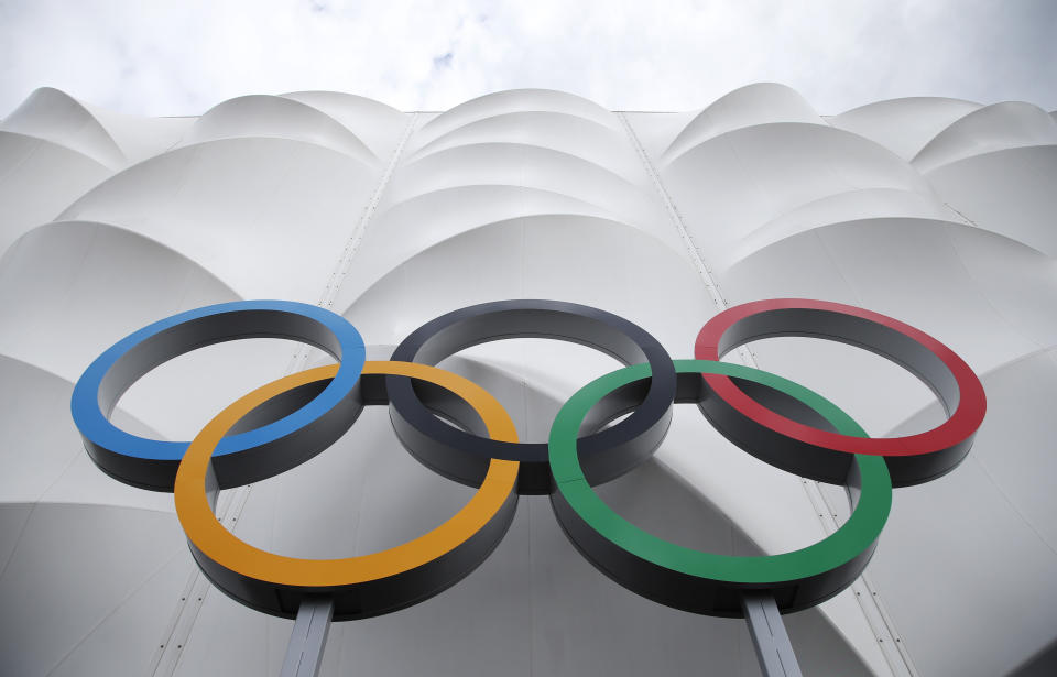 The Olympic rings are displayed outside the basketball arena in the Olympic Park before the start of the 2012 Summer Olympics, Sunday, July 15, 2012, in London. (AP Photo/Jae Hong)