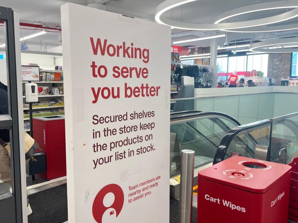 A sign explaining secured shelves at Target in New York City.