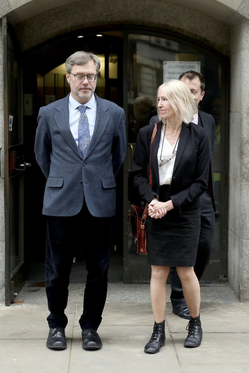 John Letts and Sally Lane speaks outside the Old Bailey in London, Friday, June 21, 2019. The parents of a British man who converted to Islam and supported the Islamic State group in Syria were given suspended prison sentences for trying to send him money. Organic farmer John Letts, 58, and ex-Oxfam fundraiser Sally Lane, 56, say they were acting as any parents would have done when they tried to send their 23-year-old son cash. (Yui Mok/PA via AP)