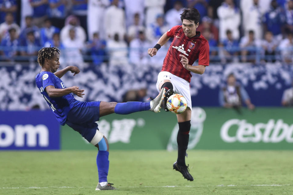 Urawa Reds' Sakine Takahiro, right, fights for the ball with Al Hilal's Andre Diaz during the first leg of the AFC Champions League final soccer match between Al Hilal and Urawa Red at King Fahd stadium in Riyadh, Saudi Arabia, Saturday, Nov. 9, 2019. Al Hilal won 1-0. (AP Photo)