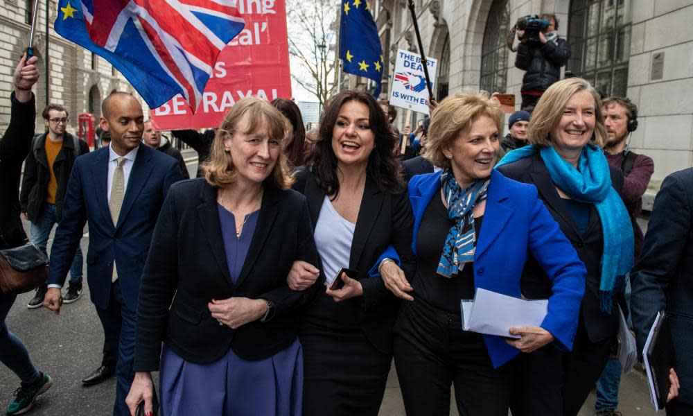 Former Labour party MP Joan Ryan (left) links arms with former Conservative MPs Heidi Allen (second left), Anna Soubry (second right) and Sarah Wollaston (right) as they arrived at a press conference on their resignations today.