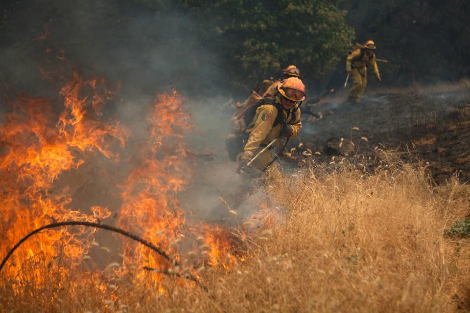 Members of the CAL Fire Vina Helitack crew battle the "Sand Fire" near Plymouth, California