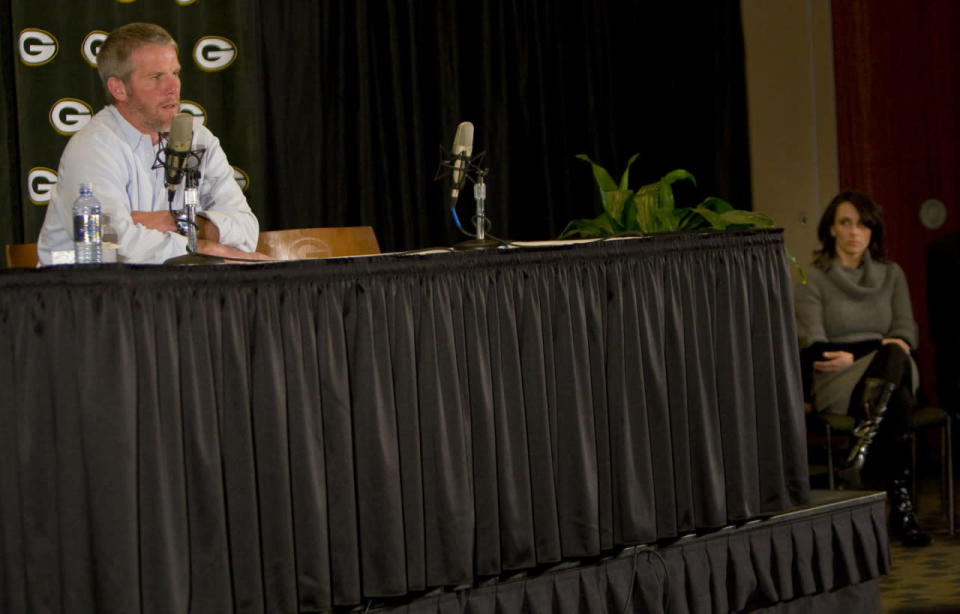 <p>With his wife Deanna looking on, Green Bay Packers quarterback Brett Favre talks about his retirement on Thursday March 6, 2008 during a press conference at Lambeau Field in Green Bay, Wis. (AP Photo/Mike Roemer)</p>
