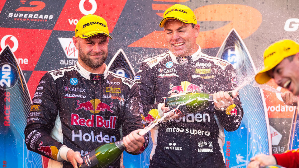 Shane van Gisbergen pipped teammate Craig Lowndes to claim the Gold Coast victory.