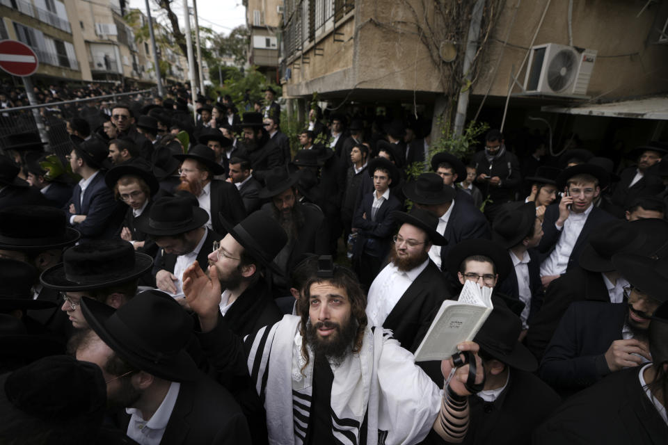 Ultra-Orthodox Jews attend the funeral of Rabbi Chaim Kanievsky in Bnei Brak, Israel Sunday, March 20, 2022. Kanievsky was one of the most influential scholars in the religious community in Israel. He died Friday at the age of 94. (AP Photo/Ariel Schalit)