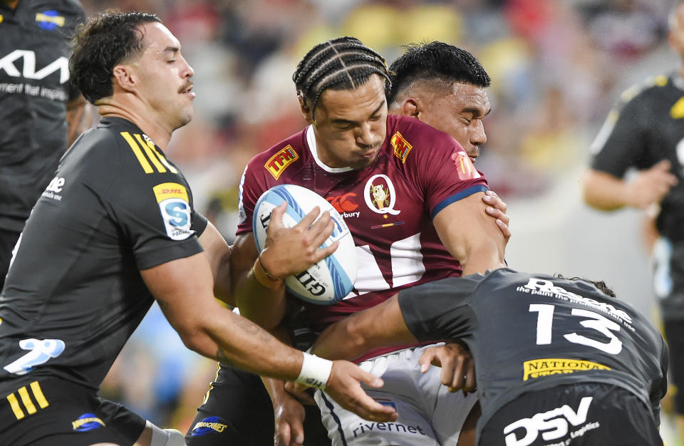 Jordan Petaia of the Queensland Reds runs with the ball during the Super Rugby Pacific Round 1 match against the Hurricanes at Queensland Country Bank Stadium in Townsville, Australia Saturday, Feb. 25, 2023. (Scott Radford-Chisholm/AAP Image)