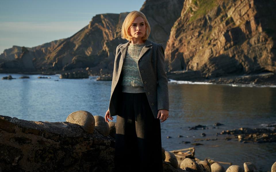 Lily James wears tweed and a zig-zag knit in Rebecca's beach scene - Netflix