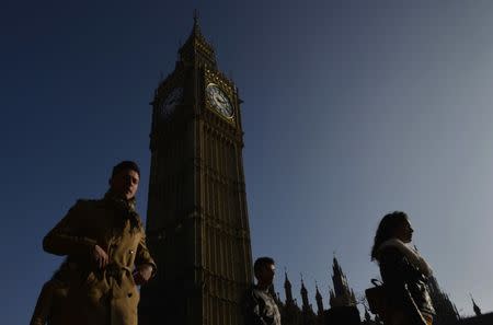 People walk past the Big Ben clock tower in London, Britain, February 13, 2017. REUTERS/Hannah McKay