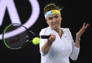 Elina Svitolina of Ukraine makes a forehand return to Lauren Davis of the U.S.during their second round singles match at the Australian Open tennis championship in Melbourne, Australia, Thursday, Jan. 23, 2020. (AP Photo/Andy Brownbill)