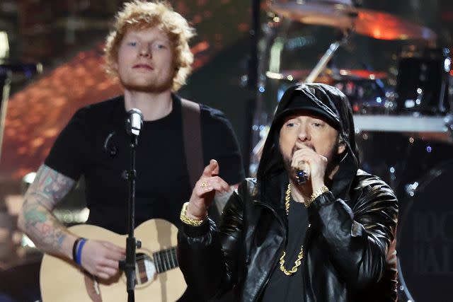<p>Kevin Kane/Getty</p> Ed Sheeran and Eminem performing at his Rock and Roll Hall of Fame induction in Los Angeles in November 2022
