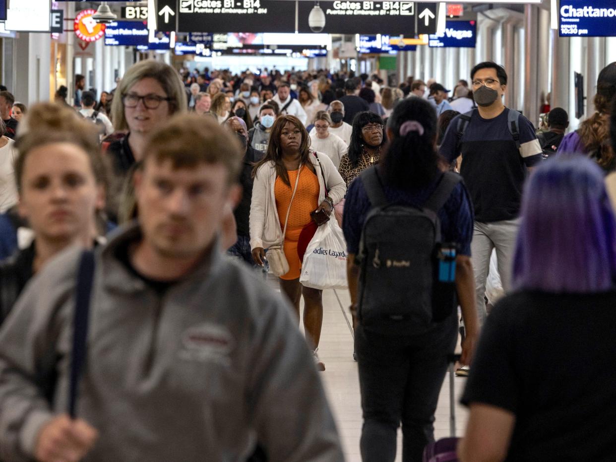 Passengers walk along terminal B of Hartsfield-Jackson Atlanta International Airport in Atlanta, Georgia, U.S., September 3, 2022. REUTERS/Carlos Barria