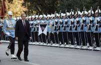 <p>Turkey’s President Recep Tayyip Erdogan inspects a military honour guard as he arrives to address the parliament in Ankara, Turkey, Saturday, Oct. 1, 2016. Erdogan hinted on Thursday that the three-month state of emergency declared following the failed July 15 coup could be extended to over a year. (AP Photo/Burhan Ozbilici) </p>