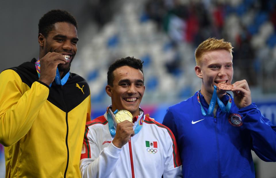 (L to R) Jamaica's Yona Knight-Wisdom, Mexico's Juan Manuel Celaya and US Andrew Capobianco pose at the podium of the Men's 1m Springboard during the Lima 2019 Pan-American Games in Lima on August 1, 2019. (Photo by PEDRO PARDO / AFP)        (Photo credit should read PEDRO PARDO/AFP/Getty Images)