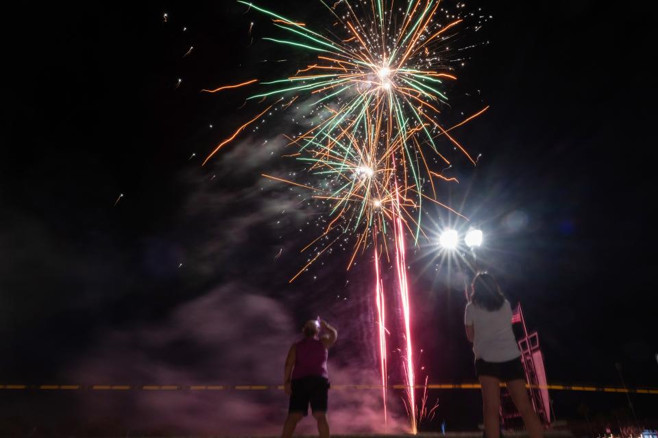 Kristi O’Neil, left, of Yuba City, and Aliza Richmond, of Stockton, watch the fireworks show Saturday, June 25, 2022, at Banner Island Ballpark in Stockton. (SARA NEVIS/FOR THE RECORD)