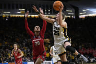 Iowa forward Monika Czinano (25) drives to the basket past Georgia forward Jordan Isaacs (20) in the second half of a second-round college basketball game in the NCAA Tournament, Sunday, March 19, 2023, in Iowa City, Iowa. (AP Photo/Charlie Neibergall)
