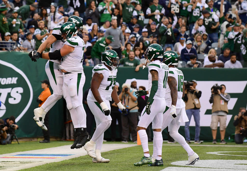 The New York Jets are celebrating their first win of the season. (Getty Images)