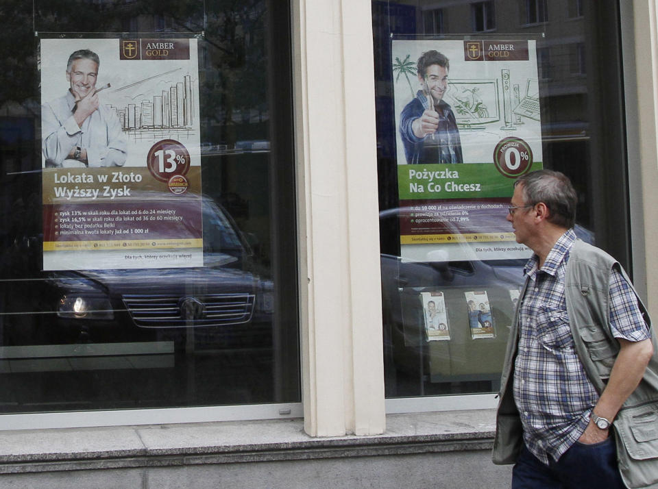 A closed outlet of the financial institute Amber Gold in Warsaw, Poland, Monday, Aug. 27, 2012, after the organization was liquidated and has emerged as an unsustainable pyramid scheme. Amber Gold promised guaranteed returns of between 10 to 14 percent annually for what it claimed were investments in gold and for many of its clients who grew up under communism the prospects of high returns on investments was too much to resist. Now officials say it operated like a pyramid scheme, and thousands of its clients are facing the prospect of never seeing their money again.(AP Photo/Czarek Sokolowski)