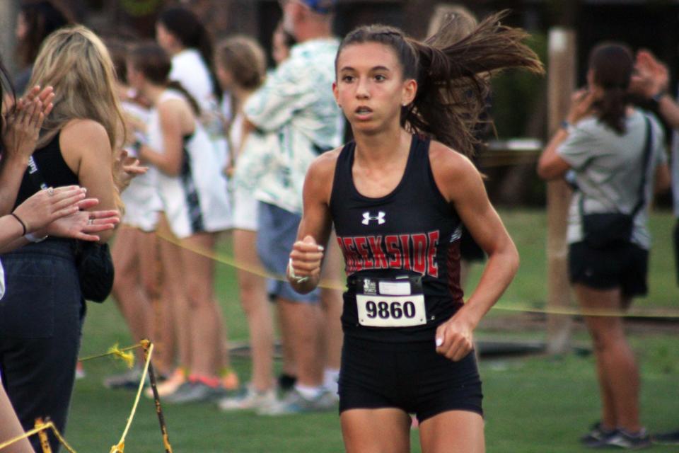 Creekside's Alyson Johnson (9860) runs during the girls elite race in the Katie Caples Invitational.