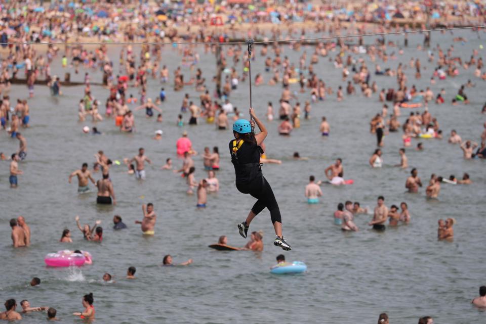 Beachgoers in Bournemouth on Saturday (PA)