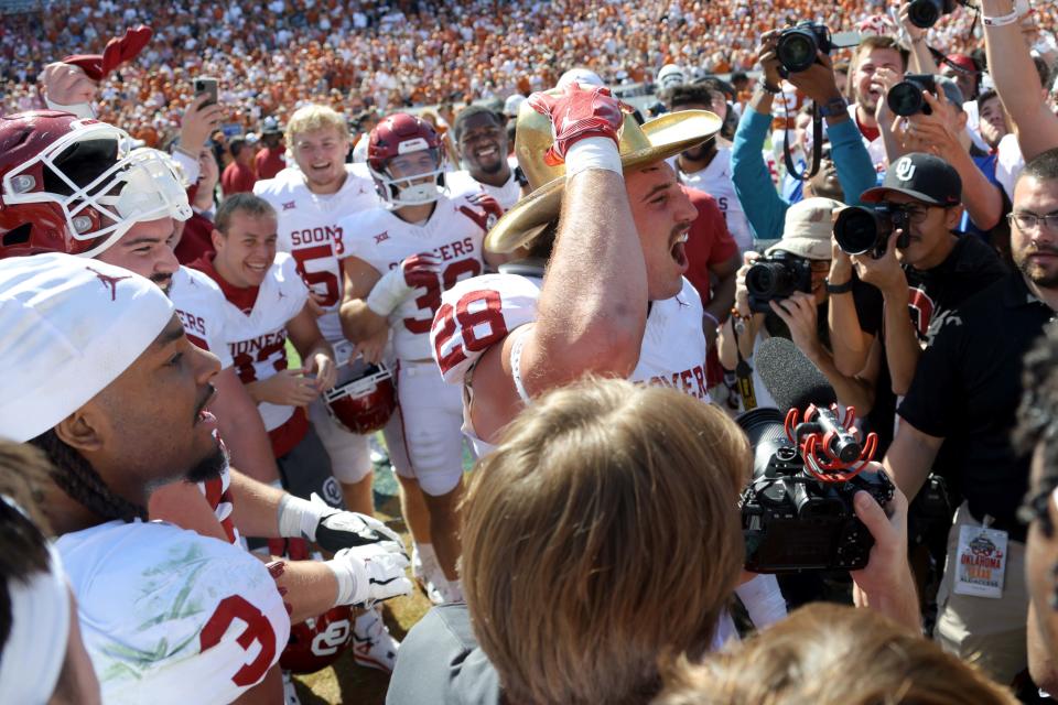 Oklahoma Sooners linebacker Danny Stutsman (28) celebrates with the Golden Hat Trophy after the Red River Rivalry college football game between the University of Oklahoma Sooners (OU) and the University of Texas (UT) Longhorns at the Cotton Bowl in Dallas, Saturday, Oct. 7, 2023. Oklahoma won 34-30.