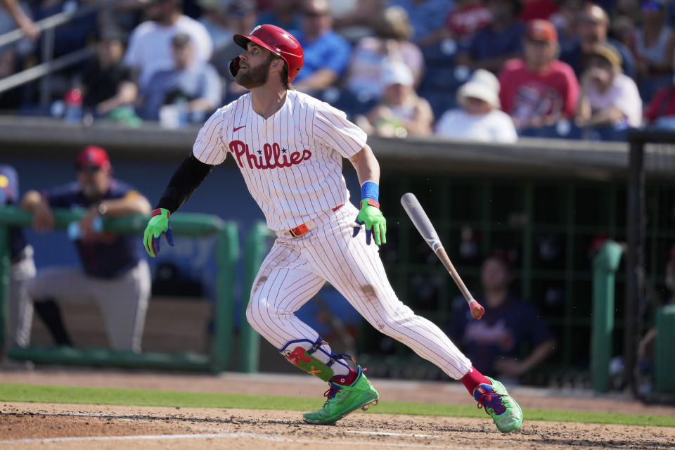 Philadelphia Phillies first baseman Bryce Harper (3) grounds out during the fifth inning of a spring training baseball game against the Atlanta Braves Wednesday, Feb. 28, 2024, in Clearwater, Fla. (AP Photo/Charlie Neibergall)