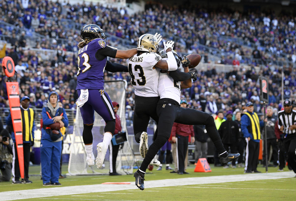 New Orleans Saints free safety Marcus Williams (43) and cornerback Marshon Lattimore, right, break up a pass-attempt to Baltimore Ravens wide receiver Willie Snead, left, in the first half of an NFL football game, Sunday, Oct. 21, 2018, in Baltimore. (AP Photo/Nick Wass)