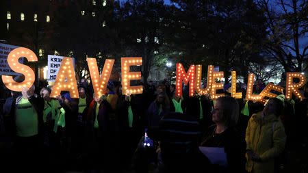 FILE PHOTO: Protesters rally to demand the U.S. government protect the investigation led by Special Counsel Robert Mueller into alleged Russian meddling in the 2016 Trump campaign, outside the White House in Washington, U.S. November 8, 2018. REUTERS/Jonathan Ernst/File Photo