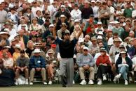 <p>Tiger Woods stretches before his putt on the 18th green during second round Masters play at the Augusta National Golf Club in Augusta, Ga., Friday, April 11, 1997. Woods shot a 66 to take the lead in the trounament. (AP Photo/ Curtis Compton) </p>