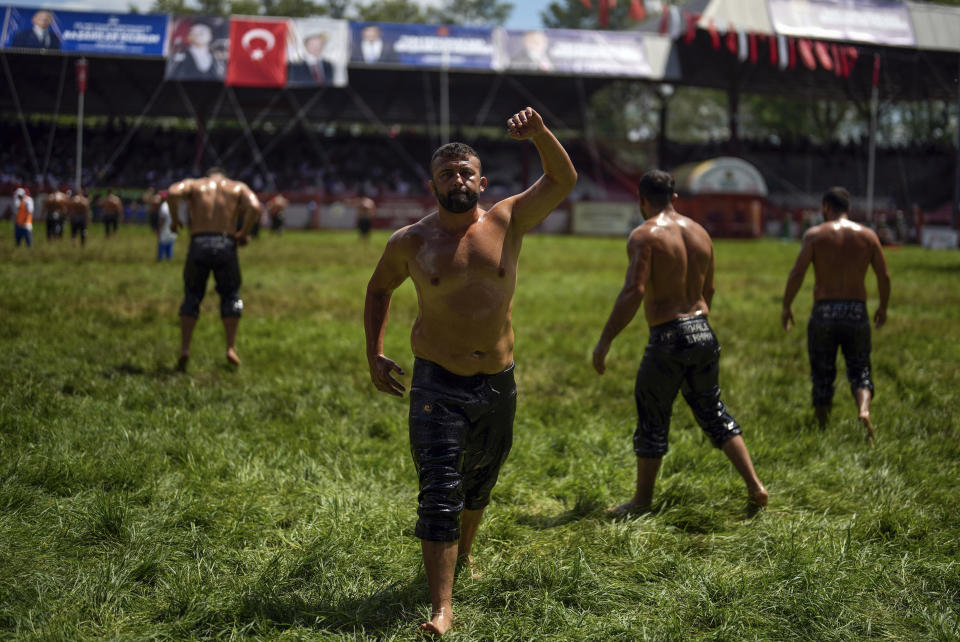 Wrestlers exercise before competing during the 663rd annual Historic Kirkpinar Oil Wrestling championship, in Edirne, northwestern Turkey, Saturday, July 6, 2024. Wrestlers take part in this "sudden death"-style traditional competition wearing only a pair of leather trousers and a good slick of olive oil. The festival is part of UNESCO's List of Intangible Cultural Heritages. (AP Photo/Khalil Hamra)