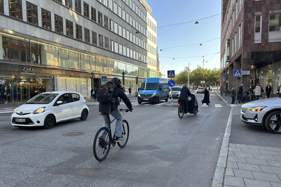 Cars drive on a road in the city center in Stockholm, Sweden, Thursday, Oct. 12, 2023. The Swedish capital plans to ban petrol and diesel cars from parts of Stockholm, gradually starting with a little-congested downtown commercial district, in an effort to curb pollution and reduce noise but also to push the technical progress toward more electric vehicles. (AP Photo/Karl Ritter)