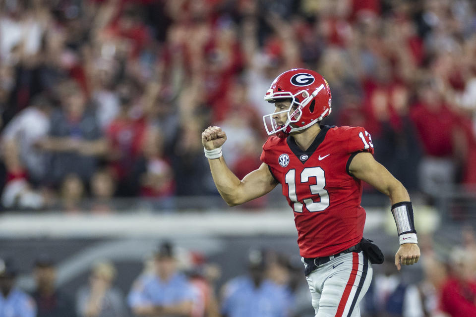 JACKSONVILLE, FLORIDA - OCTOBER 29: Stetson Bennett #13 of the Georgia Bulldogs reacts during the first half of a game against the Florida Gators at TIAA Bank Field on October 29, 2022 in Jacksonville, Florida. (Photo by James Gilbert/Getty Images)