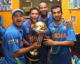 MUMBAI, INDIA - APRIL 02: Piyush Chawla (L), Sachin Tendulkar (2L),Yusuf Pathan (2R) and Gautam Gambhir (R) in the dressing room with the winners trophy during the 2011 ICC World Cup Final between India and Sri Lanka at Wankhede Stadium on April 2, 2011 in Mumbai, India. (Photo by Michael Steele/Getty Images)