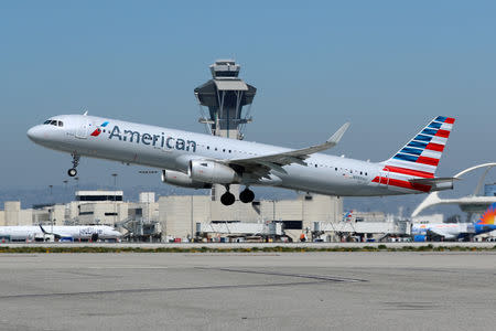 FILE PHOTO - An American Airlines Airbus A321-200 plane takes off from Los Angeles International airport (LAX) in Los Angeles, California, U.S. March 28, 2018. REUTERS/Mike Blake