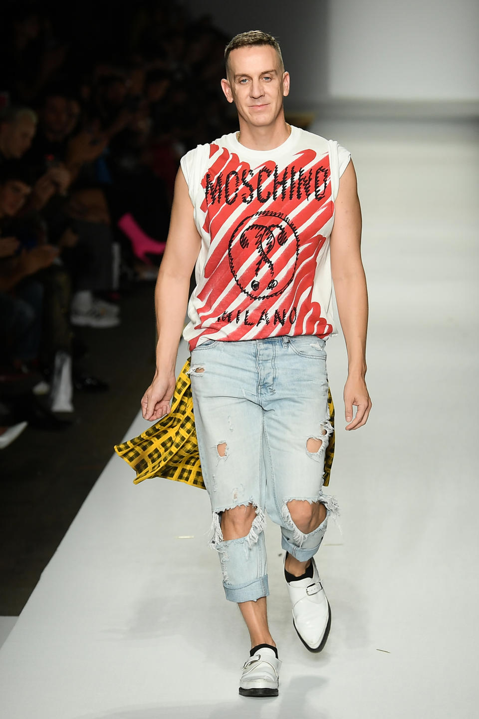 <p>US fashion designer Jeremy Scott acknowledges applause following the presentation of the Moschino fashion collection during the Women’s Spring/Summer 2019 fashion shows in Milan, on September 20, 2018. (Photo by Marco BERTORELLO / AFP) (Photo credit should read MARCO BERTORELLO/AFP via Getty Images)</p>
