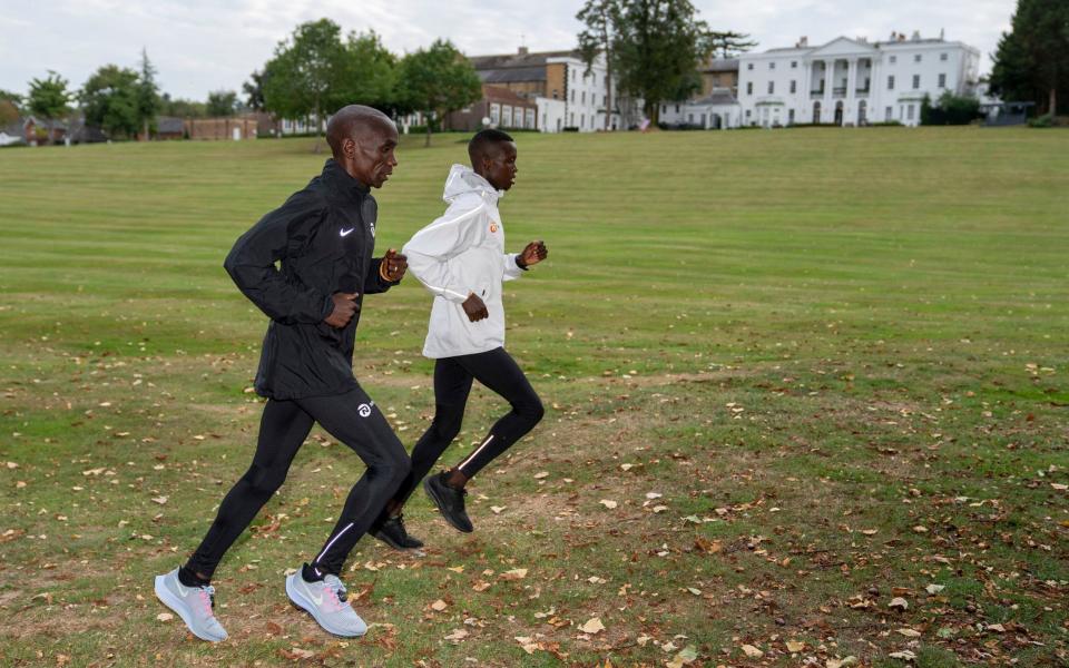 Kipchoge and a team-mate go for a run around the London Marathon hotel grounds - AP