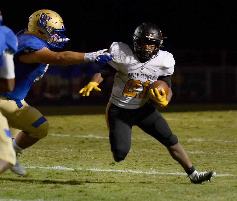 Broome played Union County at Broome High School in 3A football on Sept. 9, 2022.Union County's  Jakevious Jennings (21) breaks down the field on a play.