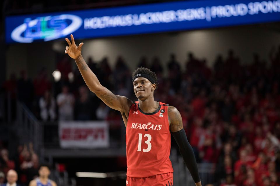 Cincinnati Bearcats forward Tre Scott (13) celebrates after hitting a shot in overtime of the NCAA mens basketball game on Thursday, Feb. 13, 2020, at Fifth Third Arena in Clifton. Cincinnati Bearcats defeated Memphis Tigers in overtime 92-86.