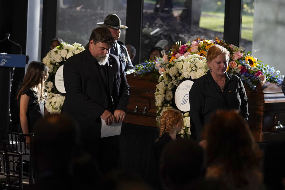 Members of the Carter family depart after a repose service for former first lady Rosalynn Carter at the Jimmy Carter Presidential Library and Museum in Atlanta, Monday, Nov. 27, 2023. (AP Photo/Brynn Anderson, Pool)