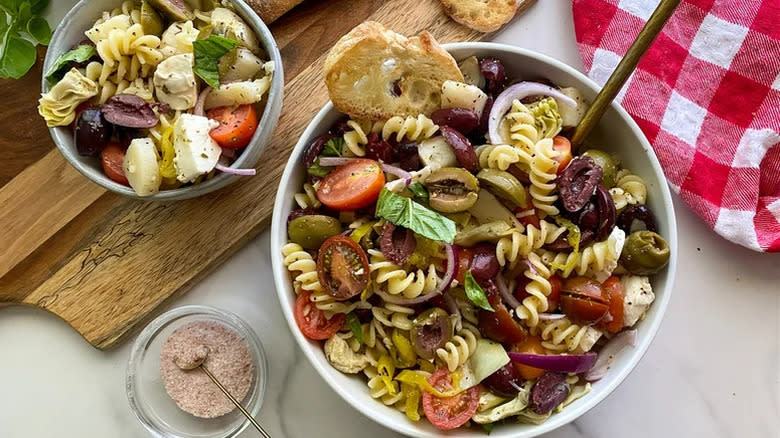 Two bowls of pasta veg salad