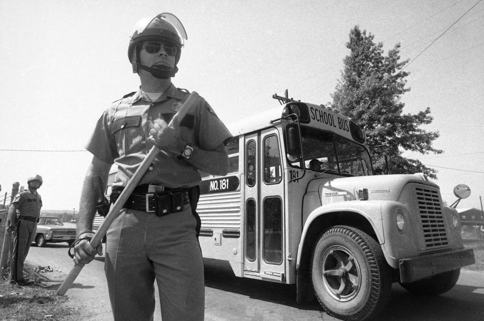 A Kentucky State trooper stands outside of Southern High School in 1975. (AP Photo)