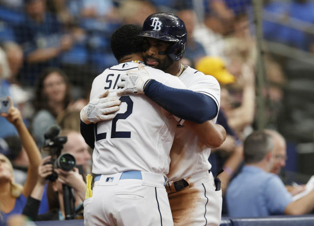 Tampa Bay Rays' Yandy Diaz, right, celebrates with teammate Jose Siri after hitting a two-run home run against the Detroit Tigers during the fourth inning of a baseball game Saturday, April 1, 2023, in St. Petersburg, Fla. (AP Photo/Scott Audette)